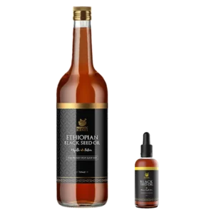 well proportioned depiction of a one litre bottle of raw cold pressed ethiopian black seed oil adjacent to a 100ml bottle with premium prophetic blends branding