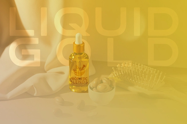 natural argan oil dropper bottle with liquid gold written and prophetic blends logo
