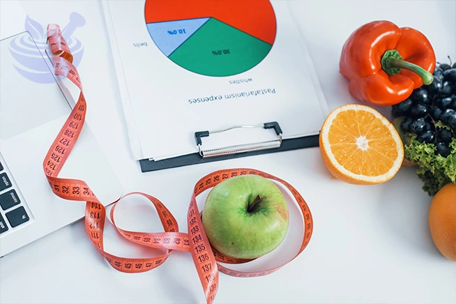 fruits lying down on the table with measure tape. conception of health care