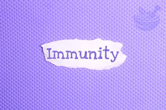 torn paper with the word Immunity on a violet background, symbolizing how black seed may support and strengthen the immune system