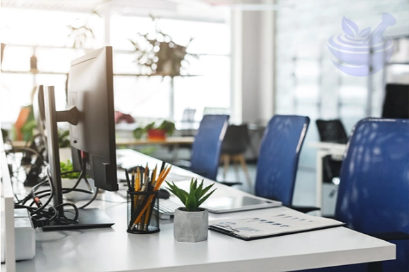 modern coworking office interior symbolising desk-related stiffness, headaches and daily work strain in the uk